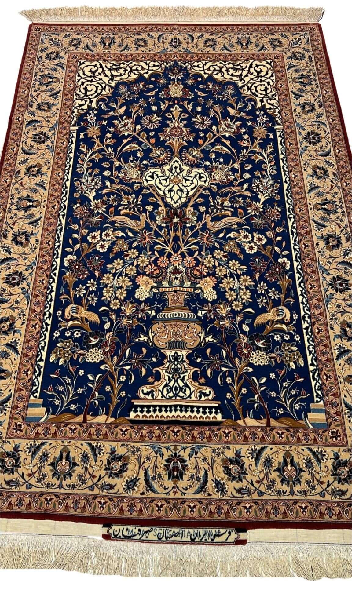 "Hand-knotted Seirafian Isfahan rug showcasing intricate floral designs, crafted from a blend of wool and silk."
